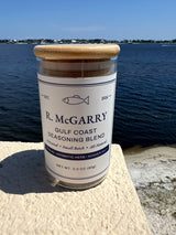 Gulf Coast Seasoning Blend jar with deep blue water behind
